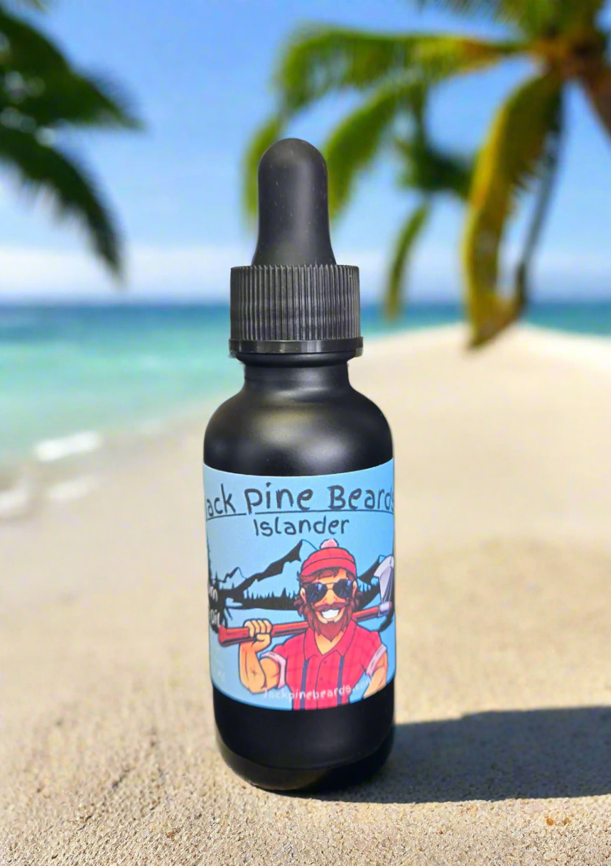 Black bottle with a colorful label featuring a person in a red hat and sunglasses on a gray surface.