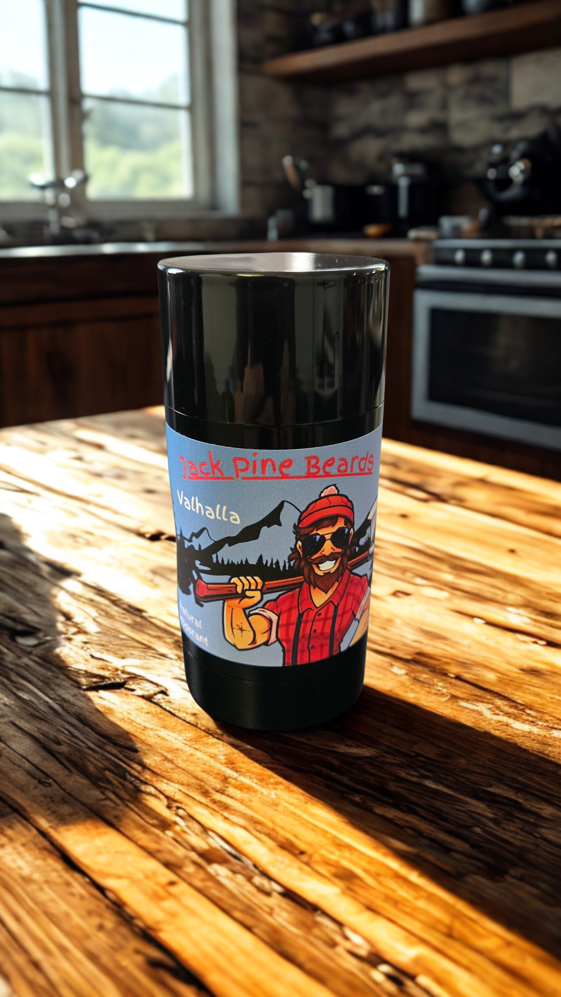 Black tumbler with a graphic design on a wooden surface